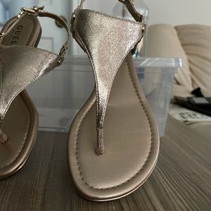 Metallic Guess flip flops